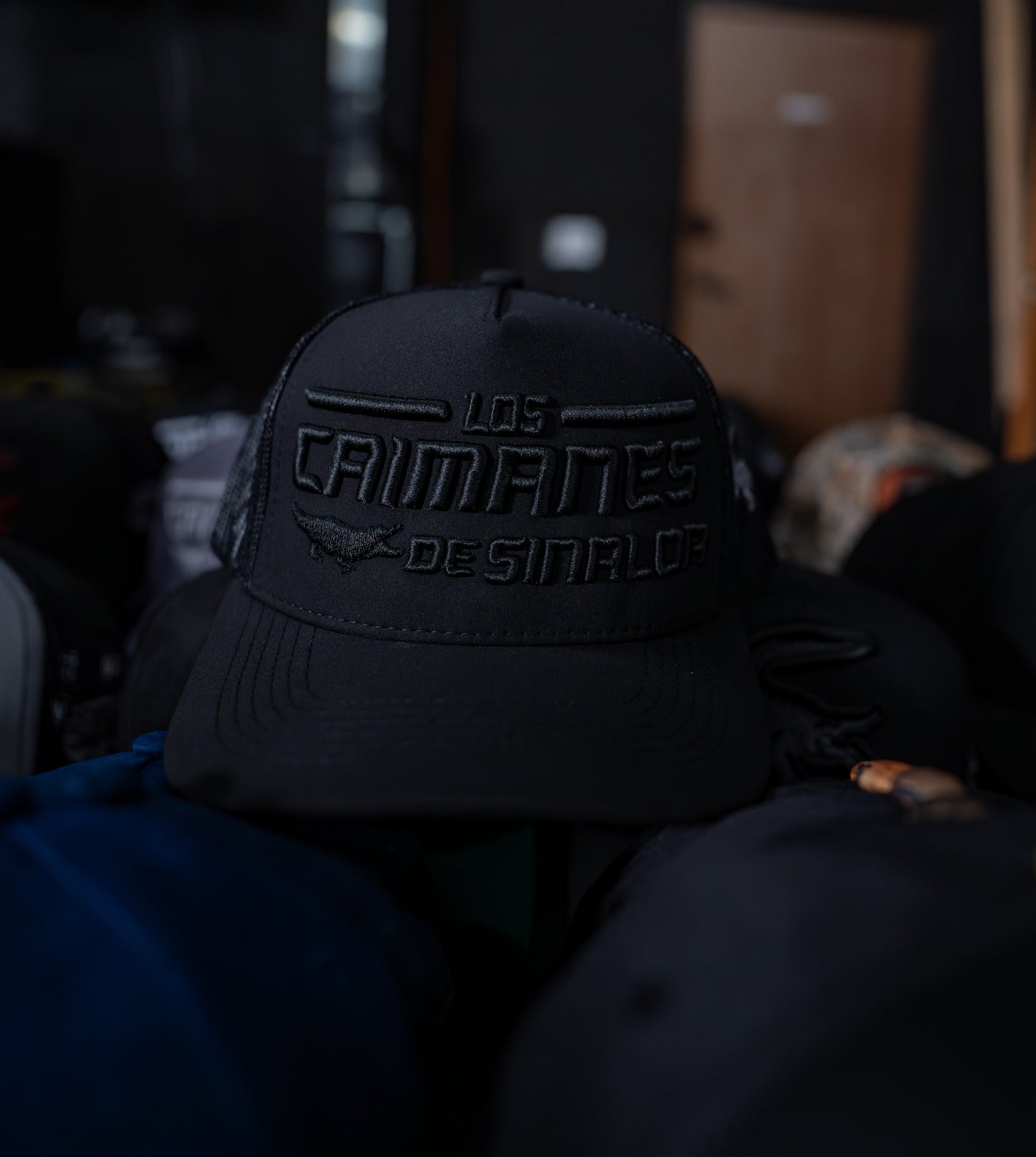 Caimanes Black Trucker Hat