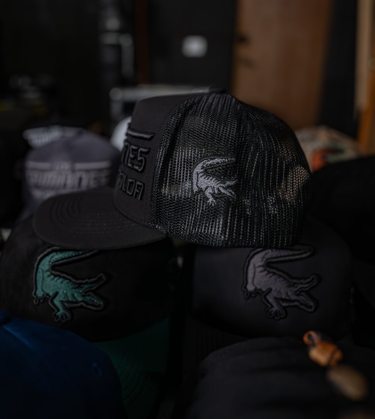 Caimanes Black Trucker Hat